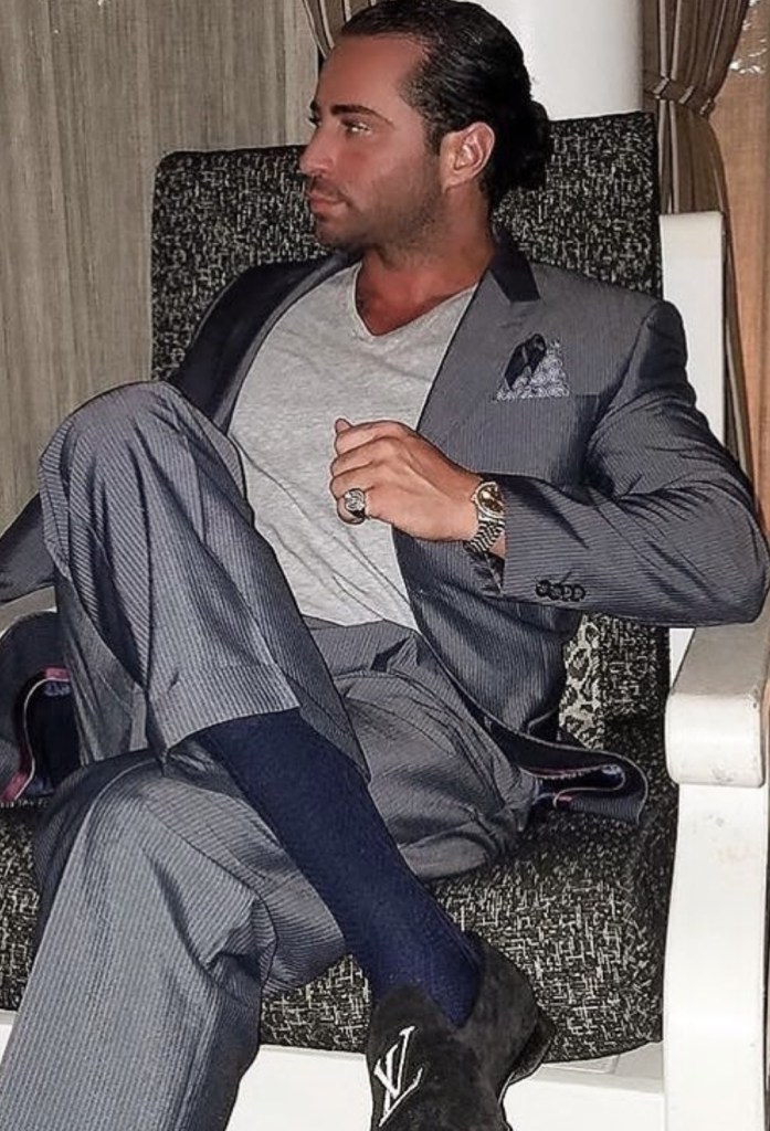 Carmine Gotti Agnello Jr luxury fashion grey suit Louis Vuitton loafers New York executive style