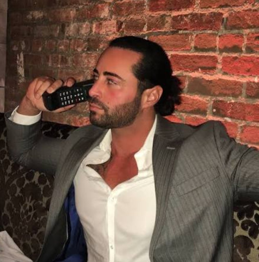 Carmine Gotti Agnello Jr businessman portrait sharp suit brick wall profile New York entrepreneur